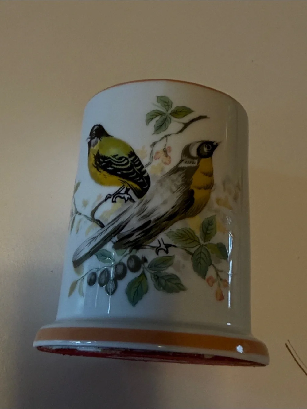 Vintage ceramic candleholder with yellow finch on both sides.  Good condition.